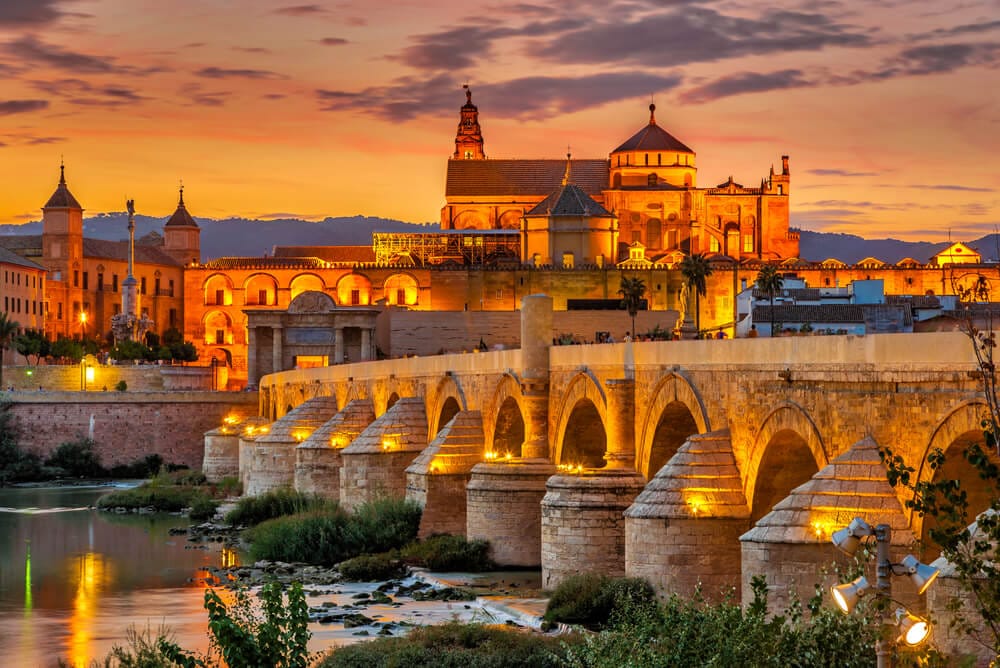 Private tours of Spain with stunning views like the Mezquita and Roman Bridge in Cordoba, pictured here.
