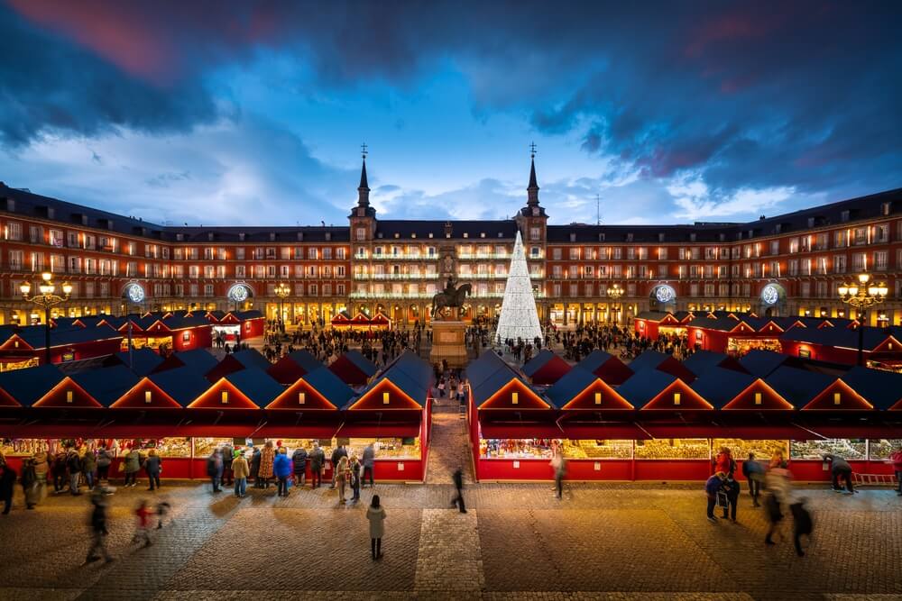 Explore beyond Madrid's façade on a private tour of Spain in the fall for fewer crowds and more authentic moments, like a lively Christmas market.