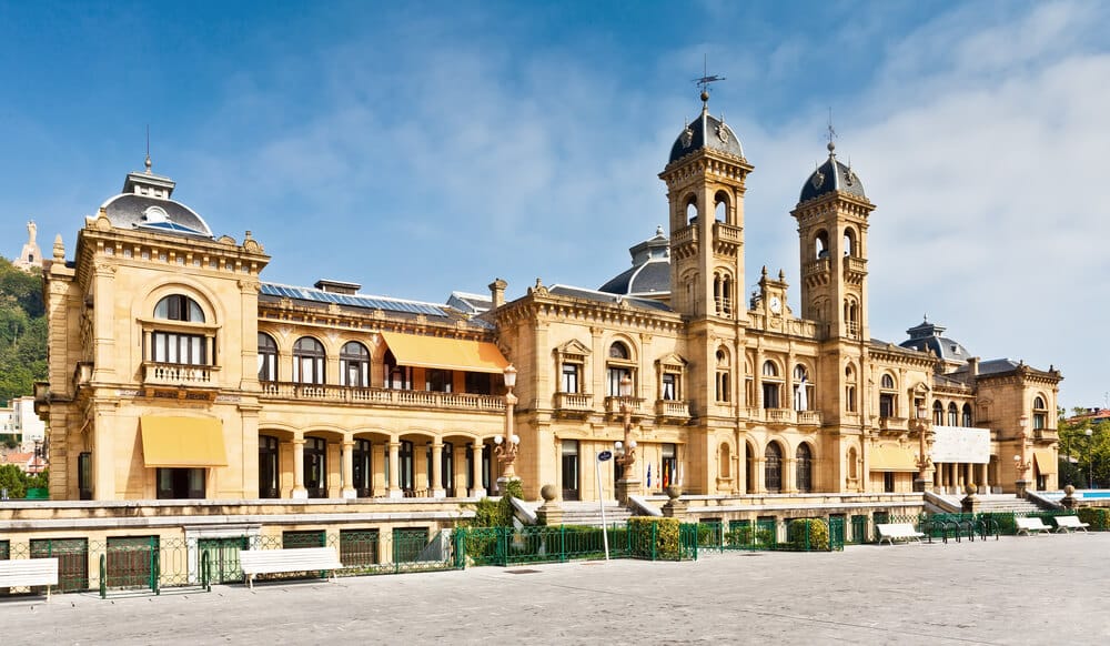 San Sebastian City Hall on the waterfront framed by palm trees and Belle Époque architecture